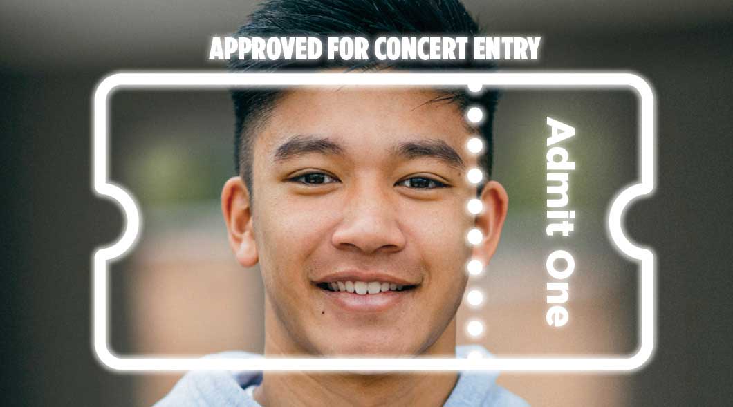 Image of a person having their face scanned to be approved for concert entry