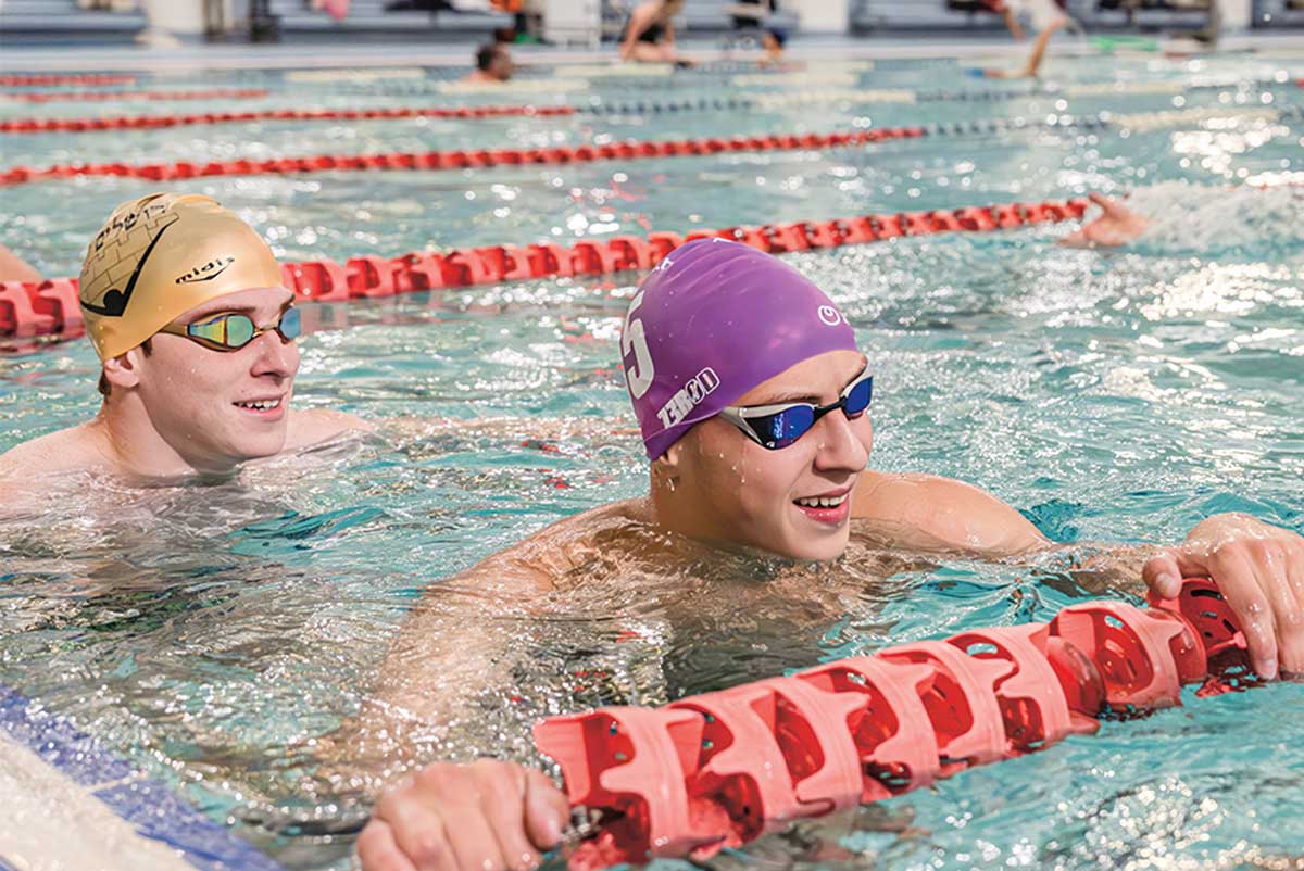 Photo of two swimmers in a pool