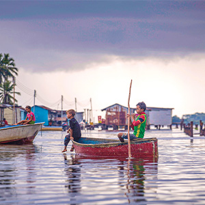 Image of kids rowing a boat in Venezuela