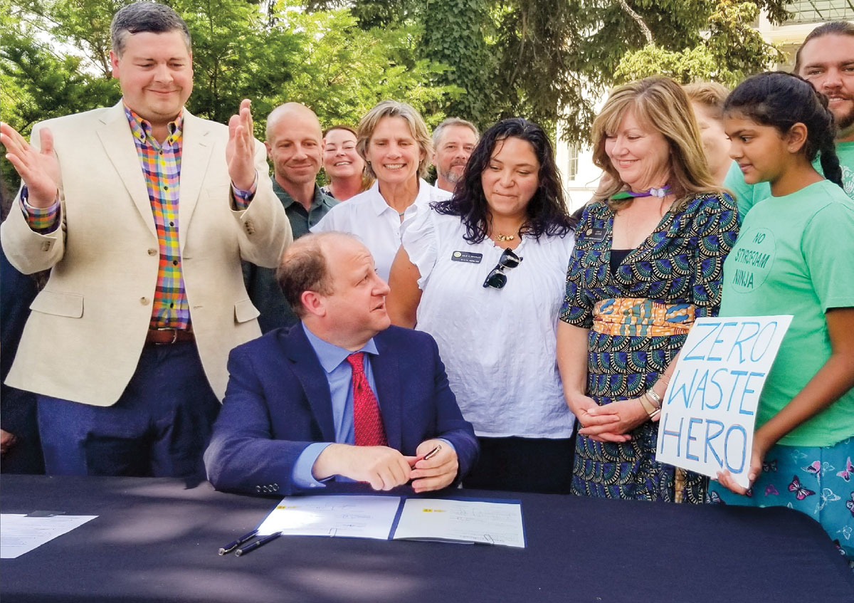 Photo of people gathered to sign a petition for no styrofoam